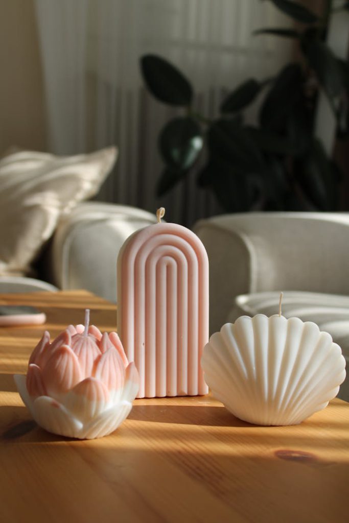 Aesthetic image of decorative candles on a wooden table in a sunlit room, Istanbul.
