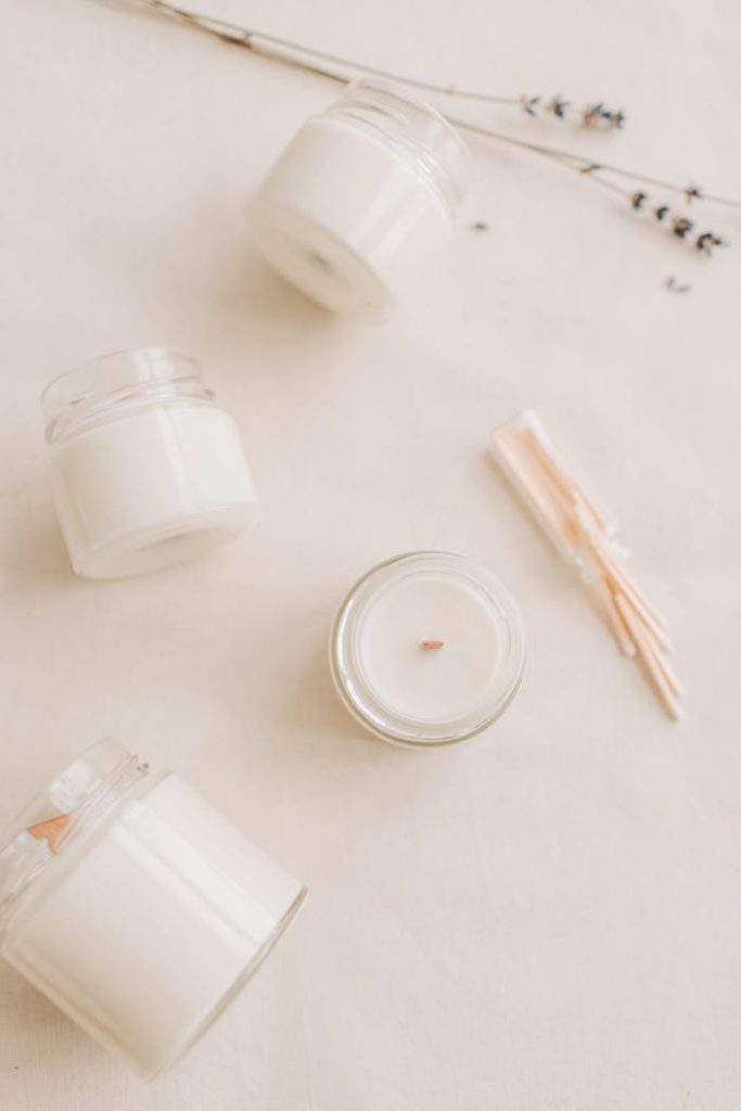 pexels-photo-6755759 Elegant minimalist arrangement with scented candles and dried lavender on a soft background.