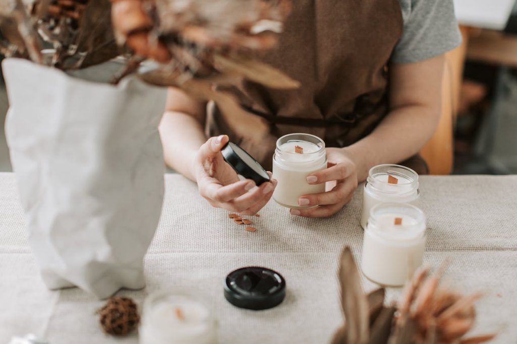 pexels-photo-6755800 A woman crafting handmade candles in a cozy indoor setting, emphasizing creativity and craft.