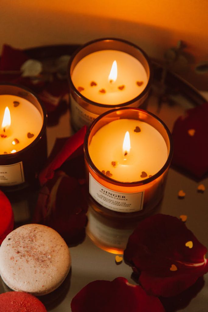 pexels-photo-6798333 Warm candlelit scene with rose petals creating a cozy, romantic ambiance.